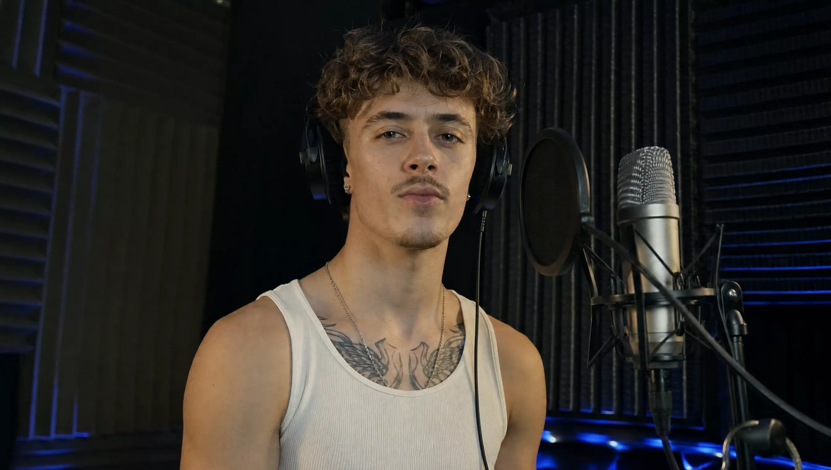 Vocalist at a studio microphone in an official Kling 4 audio demonstration